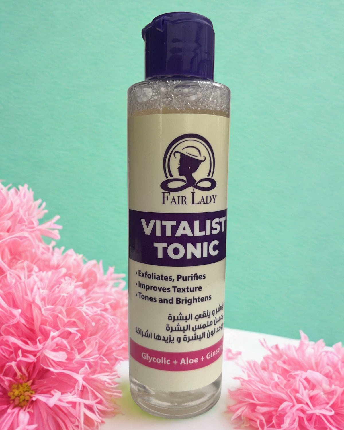 Bottle of Fair Lady Vitalist Tonic with pink flowers on a green background